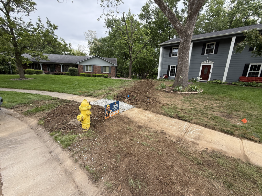 The trench backfilled and a sidewalk section patched.